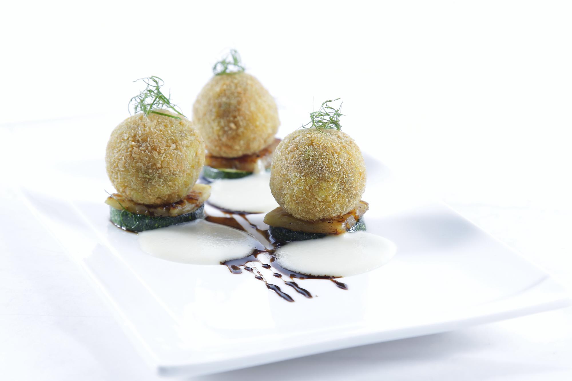 close-up of plated dessert with gold leaf